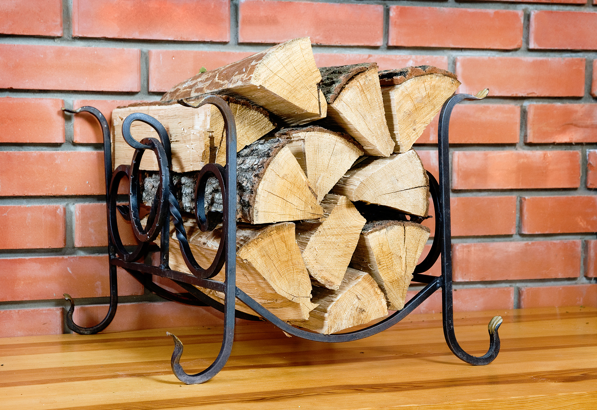 Support for fire wood against a brick wall
